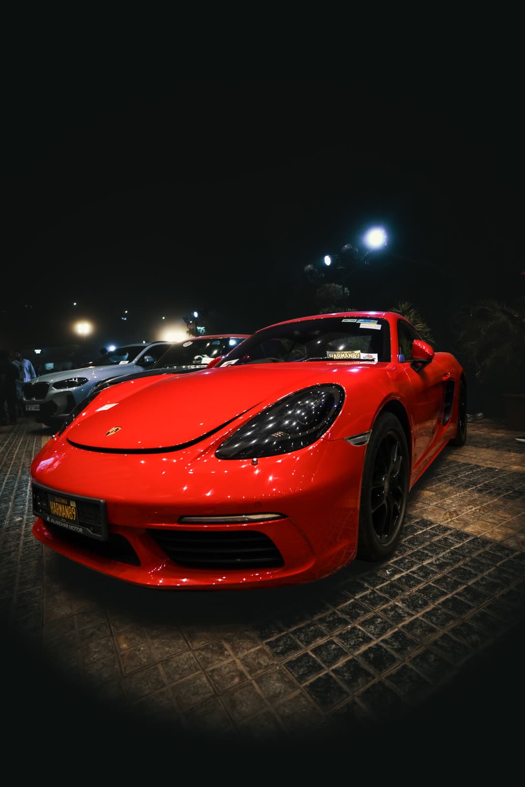 Red Porsche Cayman photographed at night